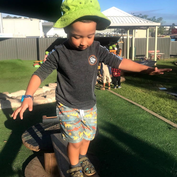 A young boy at Grace Village Early Learning practicing balance and other fundamental movement skills as part of the Munch and Move program